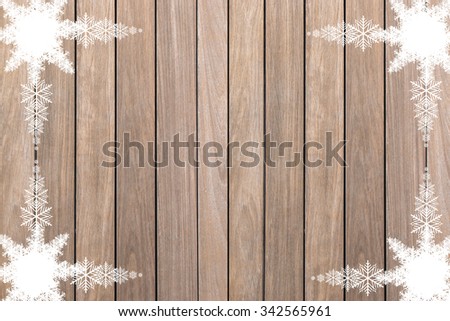 Christmas background with snowflake on wood texture.