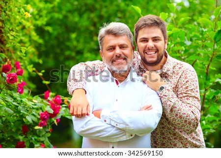 portrait of happy father and son, which are similar in appearance Royalty-Free Stock Photo #342569150