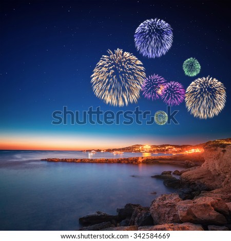 Beautiful fireworks under Ibiza island night view in San Antonio