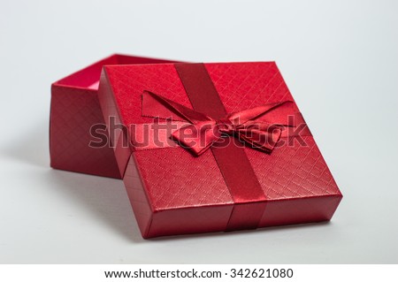 red color warping gift box with ribbon bow isolated on white background. This has clipping path.