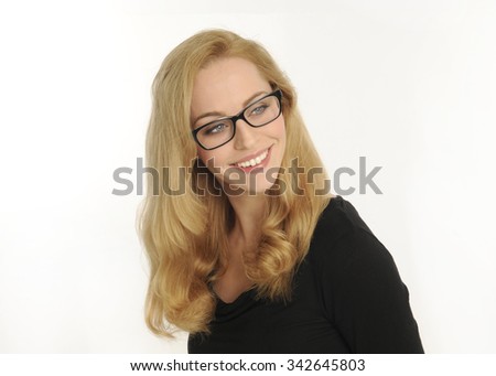 portrait of a confident and beautiful blonde woman, wearing thick rimmed black glasses.  smiling while away from camera isolated on white background.