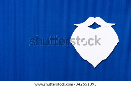 paper Santa Claus isolated over blue background