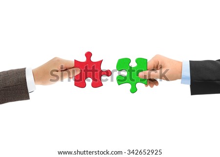 Hands and puzzle isolated on white background