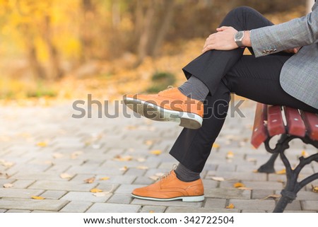 Autumn fashion style men shoes in the park Royalty-Free Stock Photo #342722504