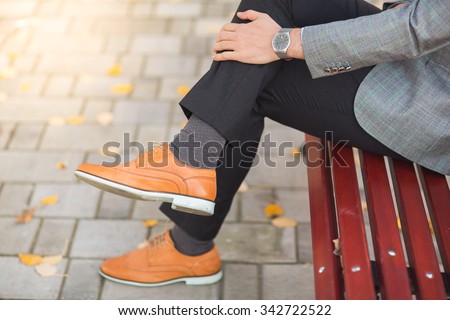 Autumn fashion style men shoes in the park Royalty-Free Stock Photo #342722522