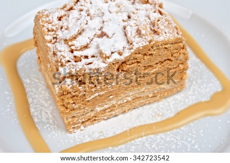 Cake Napoleon at plate closeup photo