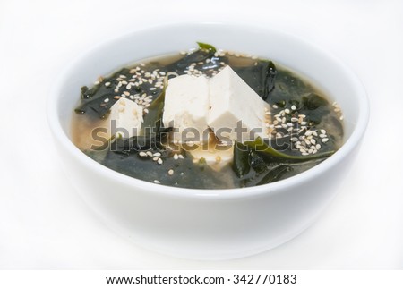 Japanese soup with herbs and cheese on white background
