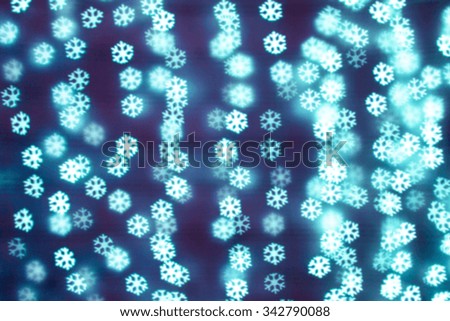 Blurring lights bokeh background of snowflakes