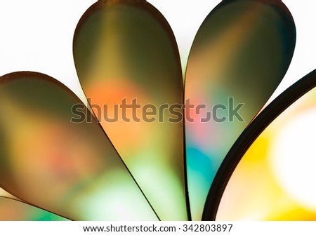 Colorful paper abstraction made with curved paper sheets and colorful lights.