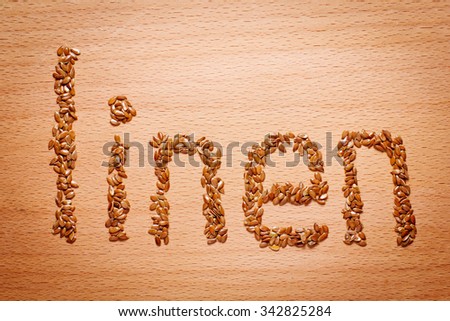 flax seeds on a wooden board