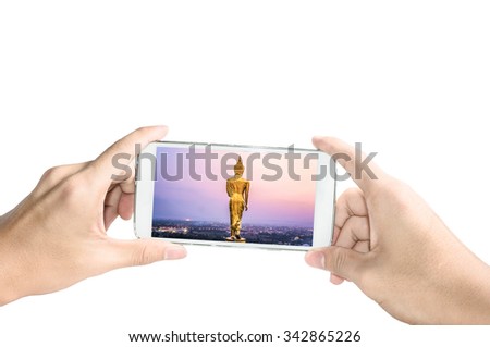 Holding smart phone take a photo of Wat Phra That Kao Noi ,Nan Thailand on white background
