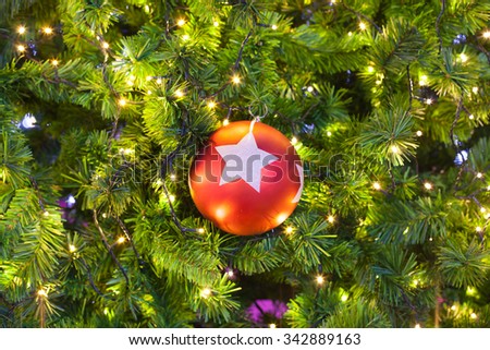 Ball ornament on the Christmas tree for background.