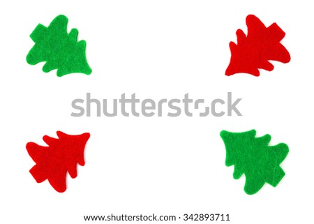 red and green christmas trees lined up as a frame on white