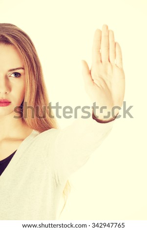 Serious woman gesturing stop sign
