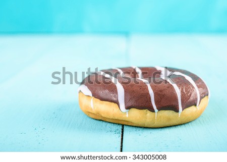 Chocolate Donut On Blue Background