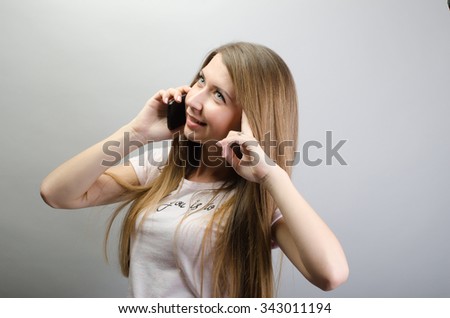 attractive young woman talking by mobile phone