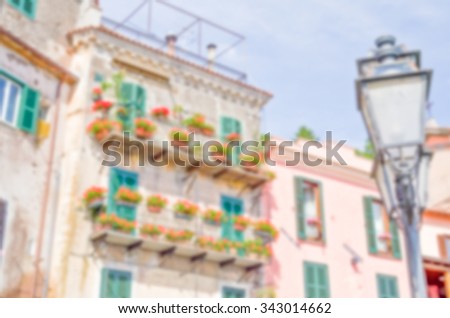 Defocused background of an ancient building in a small italian old town. Intentionally blurred post production for bokeh effect