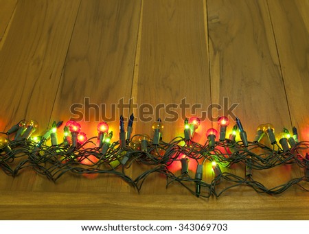 christmas lights on wood background