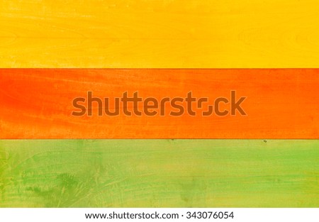 Closeup Multicolored Pattern of Yellow, Orange and Green Wooden planks suitable for Background.