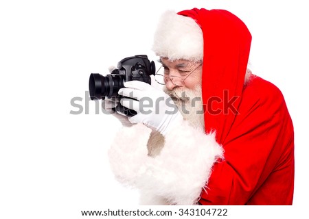 Father santa taking christmas picture