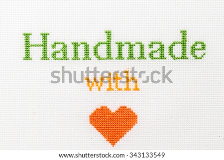 Handmade with love phrase embroidered cross stitch.  A series of embroidered titles