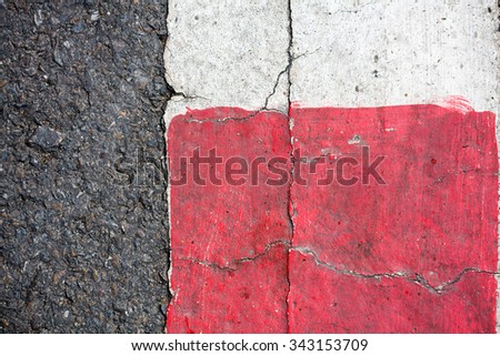asphalt texture with red and white line marking
