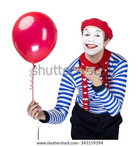 Mime with balloon.Emotional funny actor wearing sailor suit, red beret posing on white isolated background.