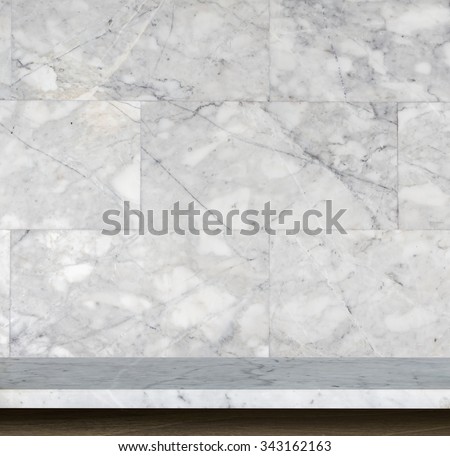 Empty top of natural stone table and stone wall background. For product display