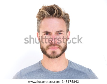 Close up horizontal portrait of a serious man with beard isolated on white background
