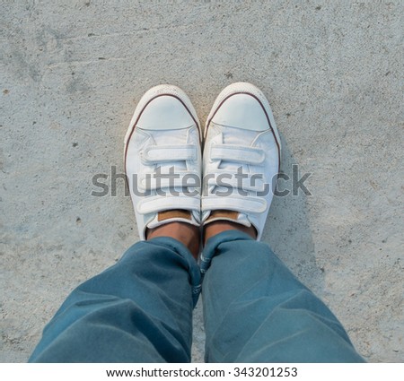 White Sneaker shoes standing on street