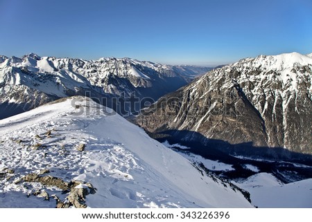 Beautiful high snowy mountains in winter. Mountain ski resort. 