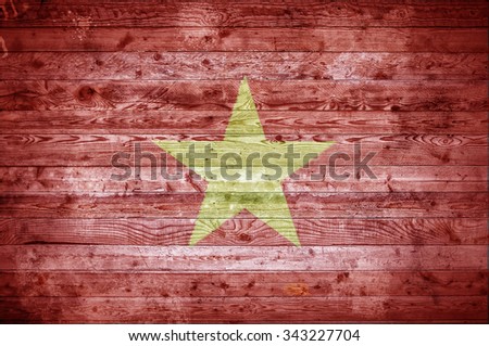 A vignetted background image of the flag of Vietnam onto wooden boards of a wall or floor.
