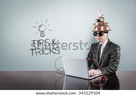 Tips and tricks concept with vintage businessman and laptop at office