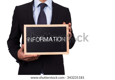 Businessman holding mini blackboard with INFORMATION message