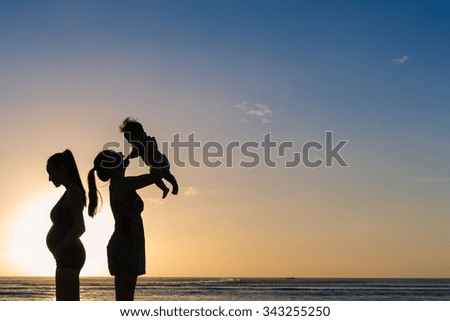 Mother and Baby Silhouette at Ocean