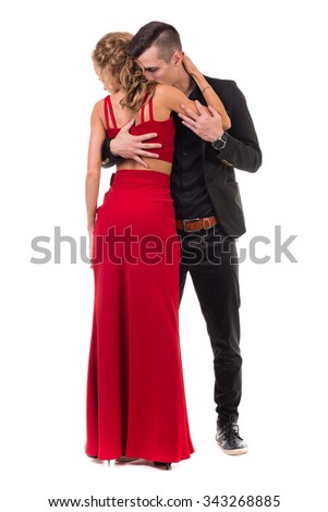 Full length of young couple dancing against isolated white background