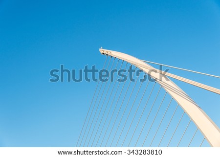Close up of famous Samuel Beckett bridge in Dublin, Ireland, in the warm autumn evening against the rarely perfect blue sky.