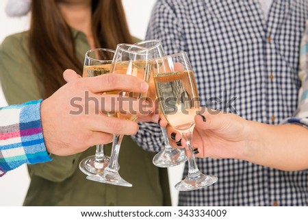 Young people celebrating event with champagne