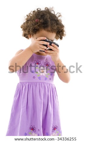 Young girl, child, shooting photos on white .