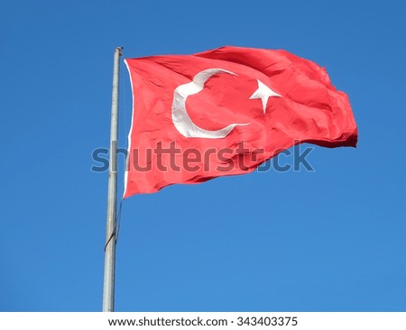 Turkish flag waving in the blue sky, Istanbul, Turkey