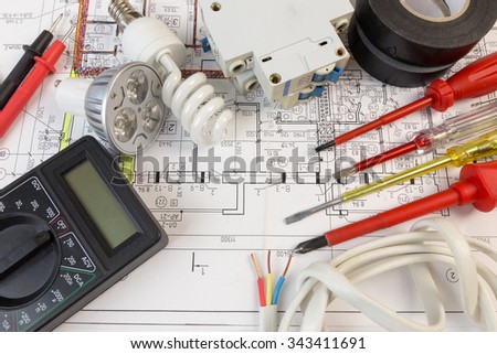 Still Life Of Electrical Components Arranged On Plans Royalty-Free Stock Photo #343411691