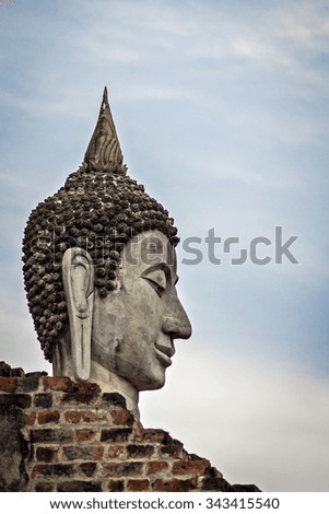 Picture from world heritage Ayutthaya site, Thai old Buddha face sculpture at Wat Yai Chaimongkol temple Ayutthaya Thailand
