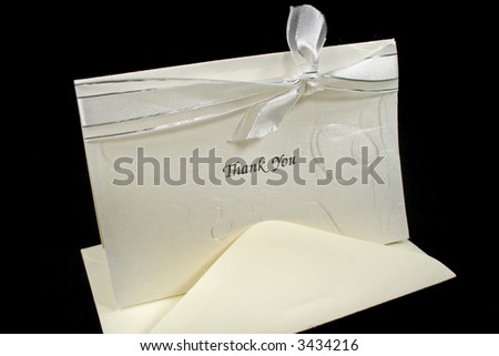 Silver embossed thank you card with bow.
