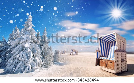 winter and summer changing season, weather concept with snow and beach, time change in the world  Royalty-Free Stock Photo #343428494