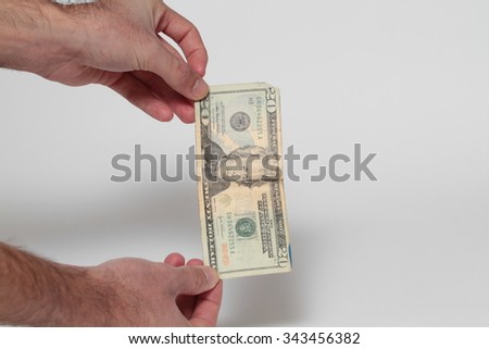 Hand holds american Dollar-bills
