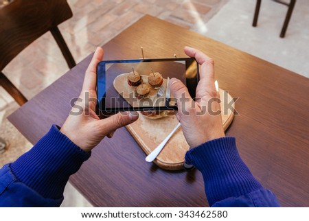 Close Up Of Woman Hands Taking Picture Of Three Burgers Sliders On Rustic Wooden Plate Using Smart Phone