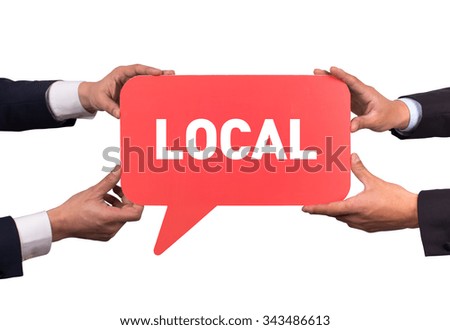 Two men holding red speech bubble with LOCAL message