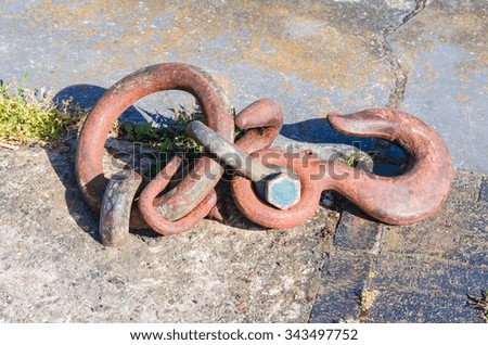 Mooring strap, steel hook and eye at a quay for securing larger motor ships.