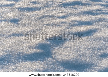 Beautiful snow field into the sunset, winter background
