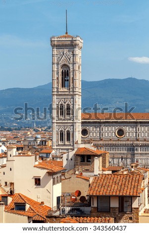 View of tiled roofs and the bell tower of the Duomo in Florence.